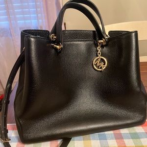 Black Michael Kors bag.